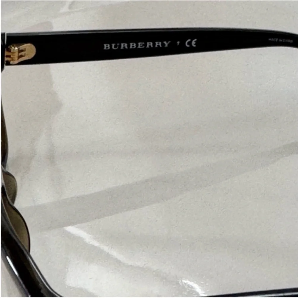 Burberry Elegant Black and Brown Glasses